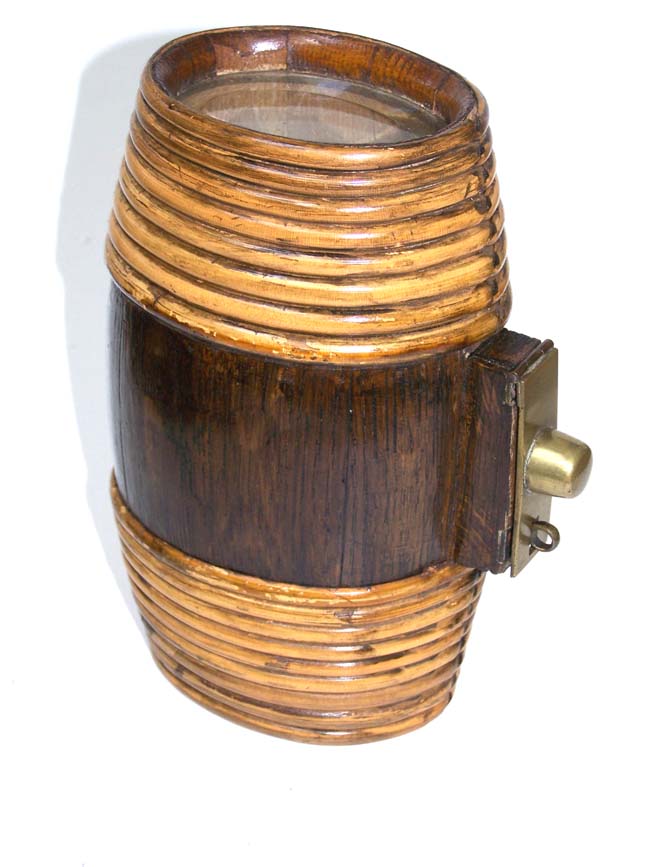 An antique whiskey flask or keg with rattan wrapped ends circa 1890-1900